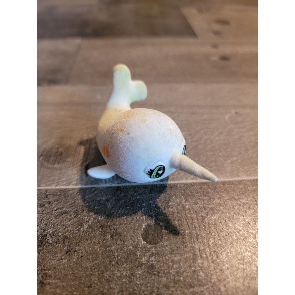 White fuzzy narwhal toy figure